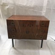 Lacquered 3-drawer chest with rosewood veneer.