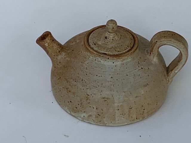 Vintage teapot in reeds
