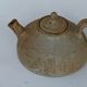 Vintage teapot in reeds