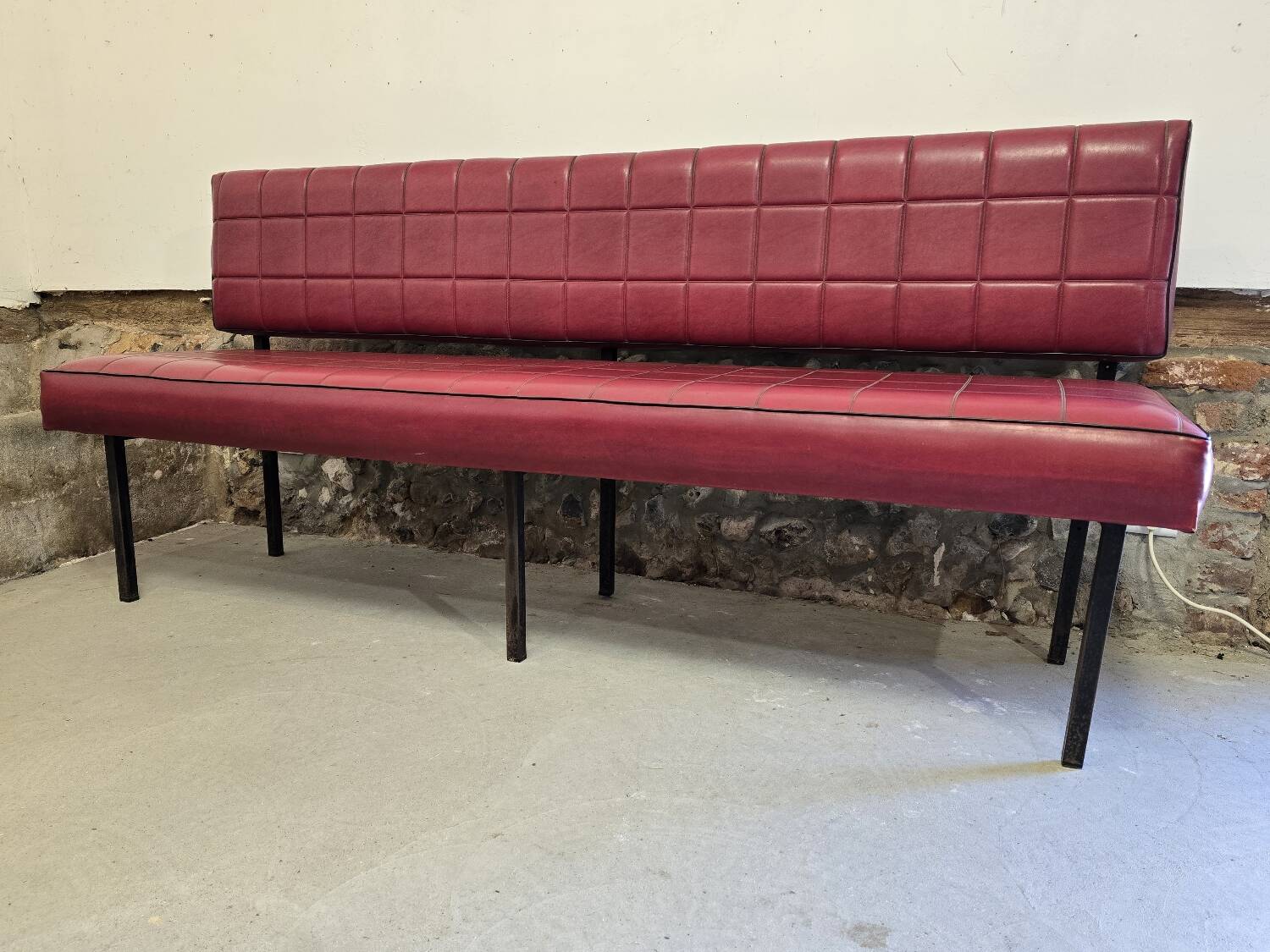 1960s double bistro bench in buttoned burgundy red skai