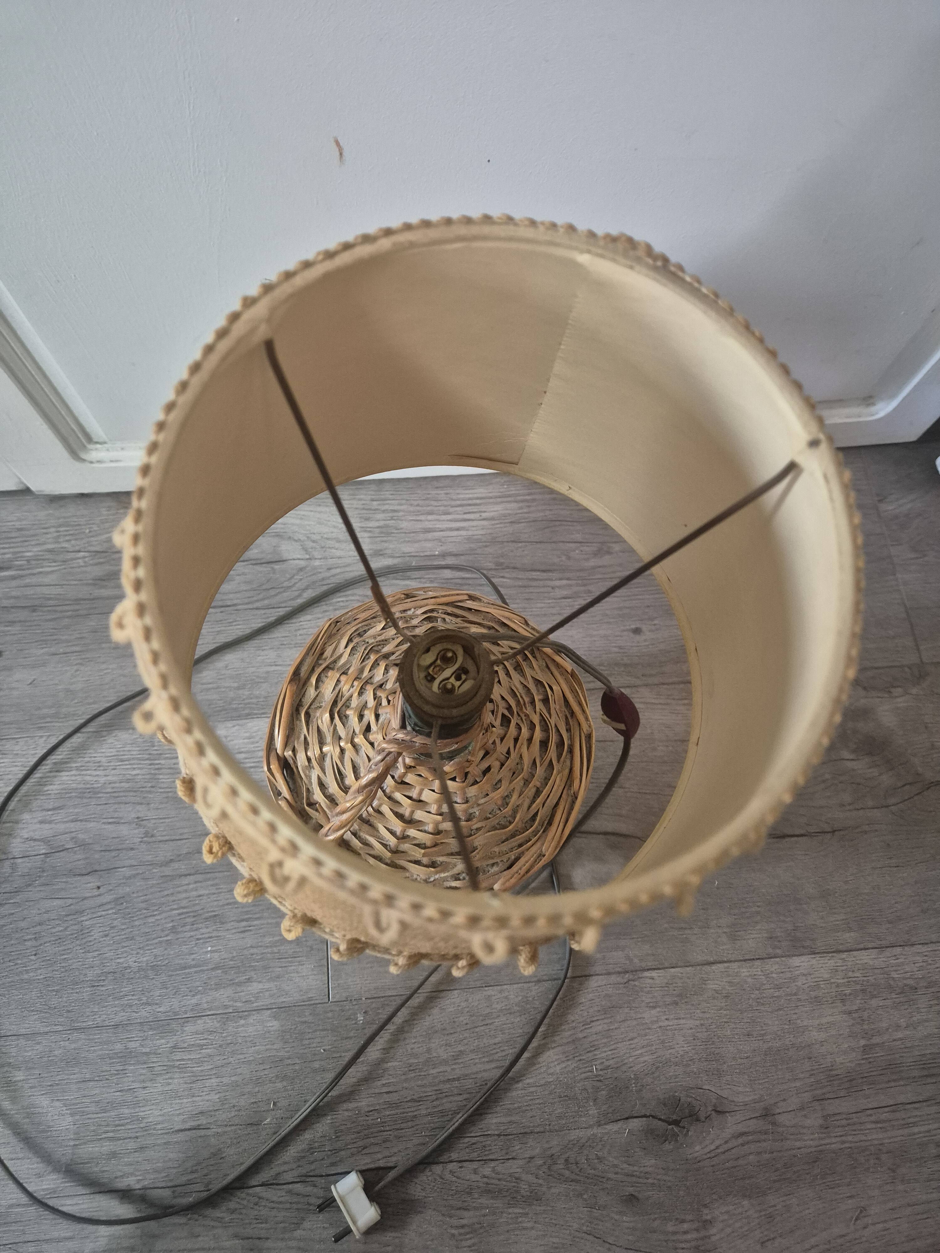 vintage table lamp dame jeanne covered in rattan wicker with a handle