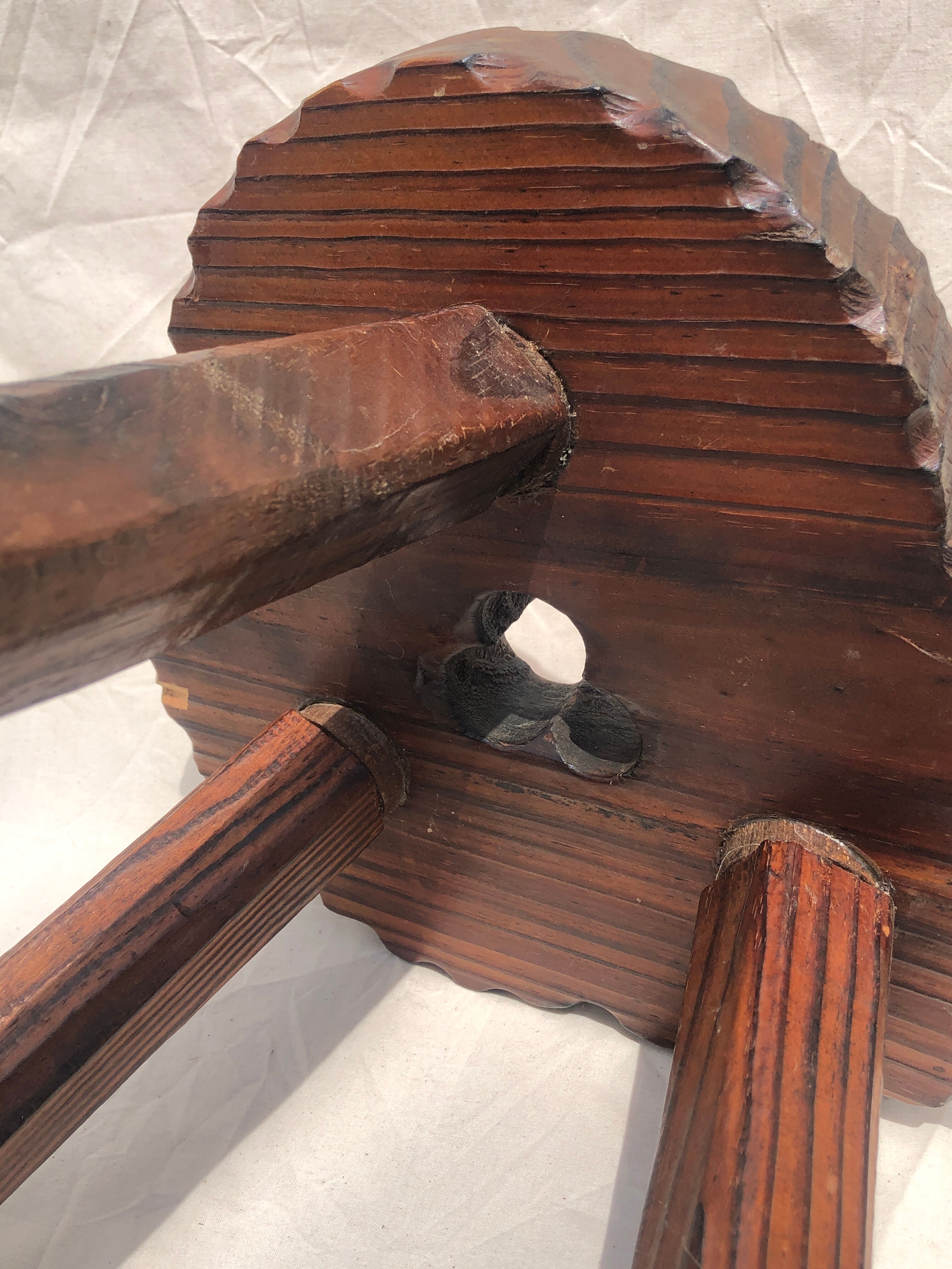 Chiseled wooden tripod stool