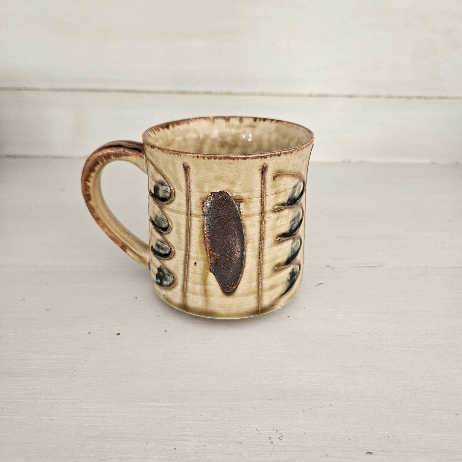 Set of 4 ceramic mugs, glazed stoneware, assorted vintage designs.