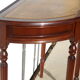 English-style half-moon console, mahogany and leather