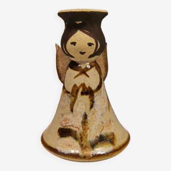 Ceramic candle holder, in the shape of an angel, signed at the bottom.