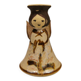 Ceramic candle holder, in the shape of an angel, signed at the bottom.