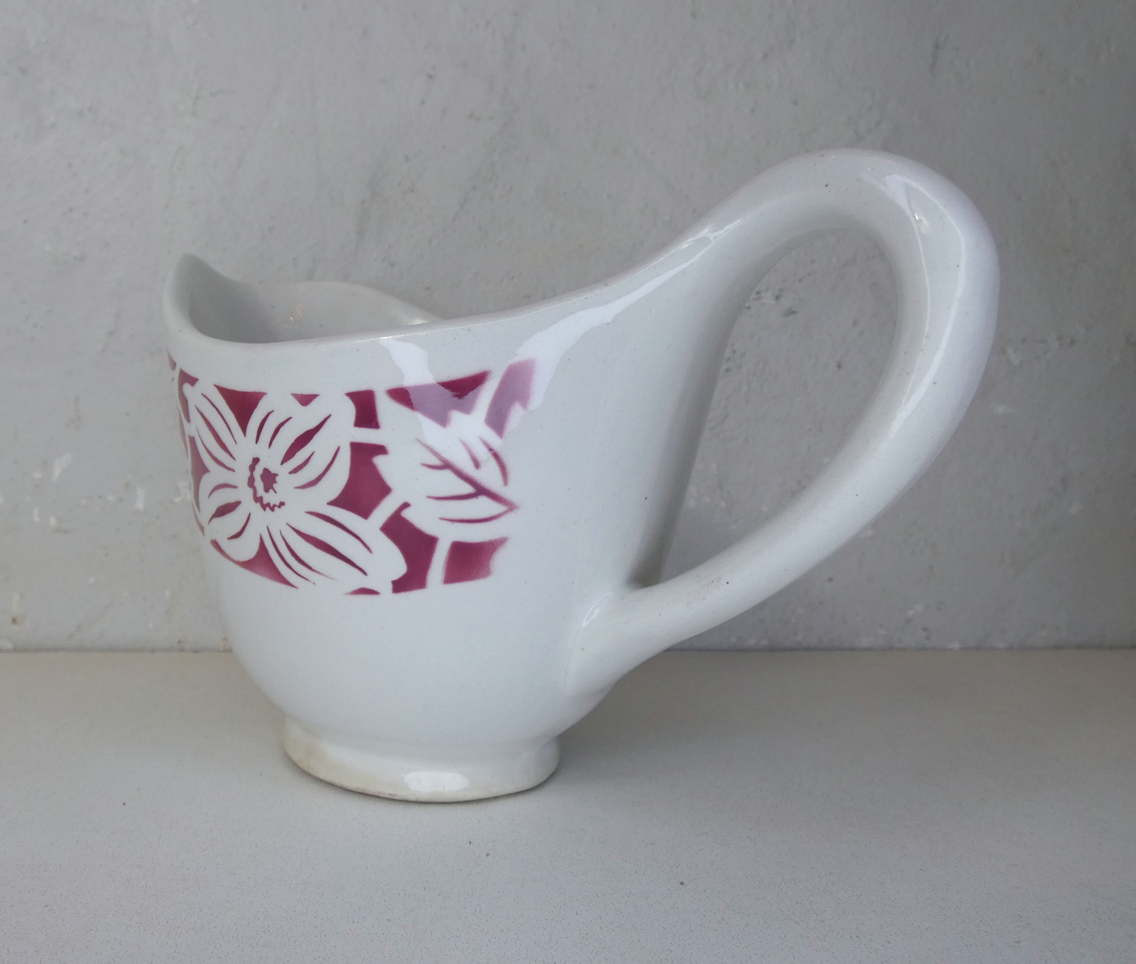 Old creamer milk pot in earthenware of Lunéville