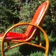 Fauteuil vintage rouge en rotin et skai rouge