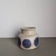Mid-century modern stoneware vase with cobalt blue dots.