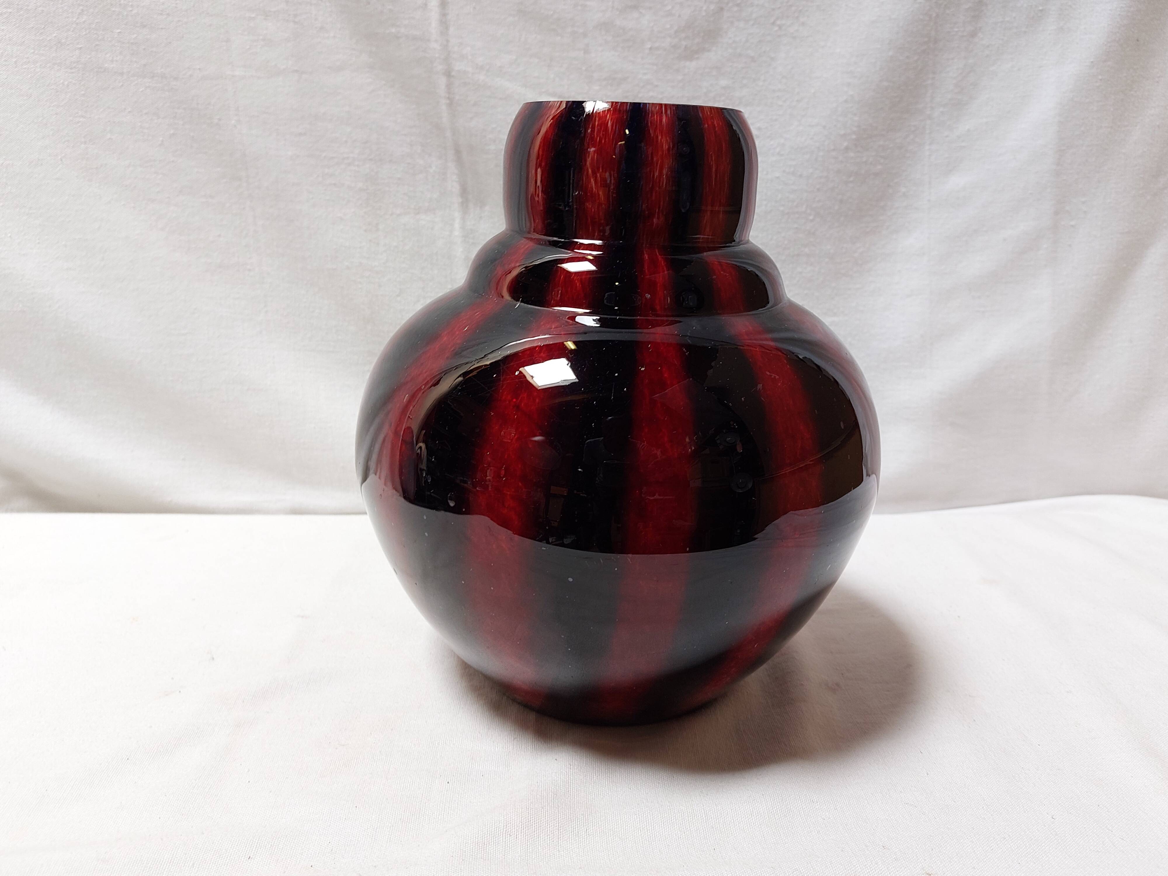 Large vintage blown glass ball vase with red and midnight blue flamed decor