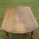 Old solid oak round table, diameter 115cm 6 feet on wheels