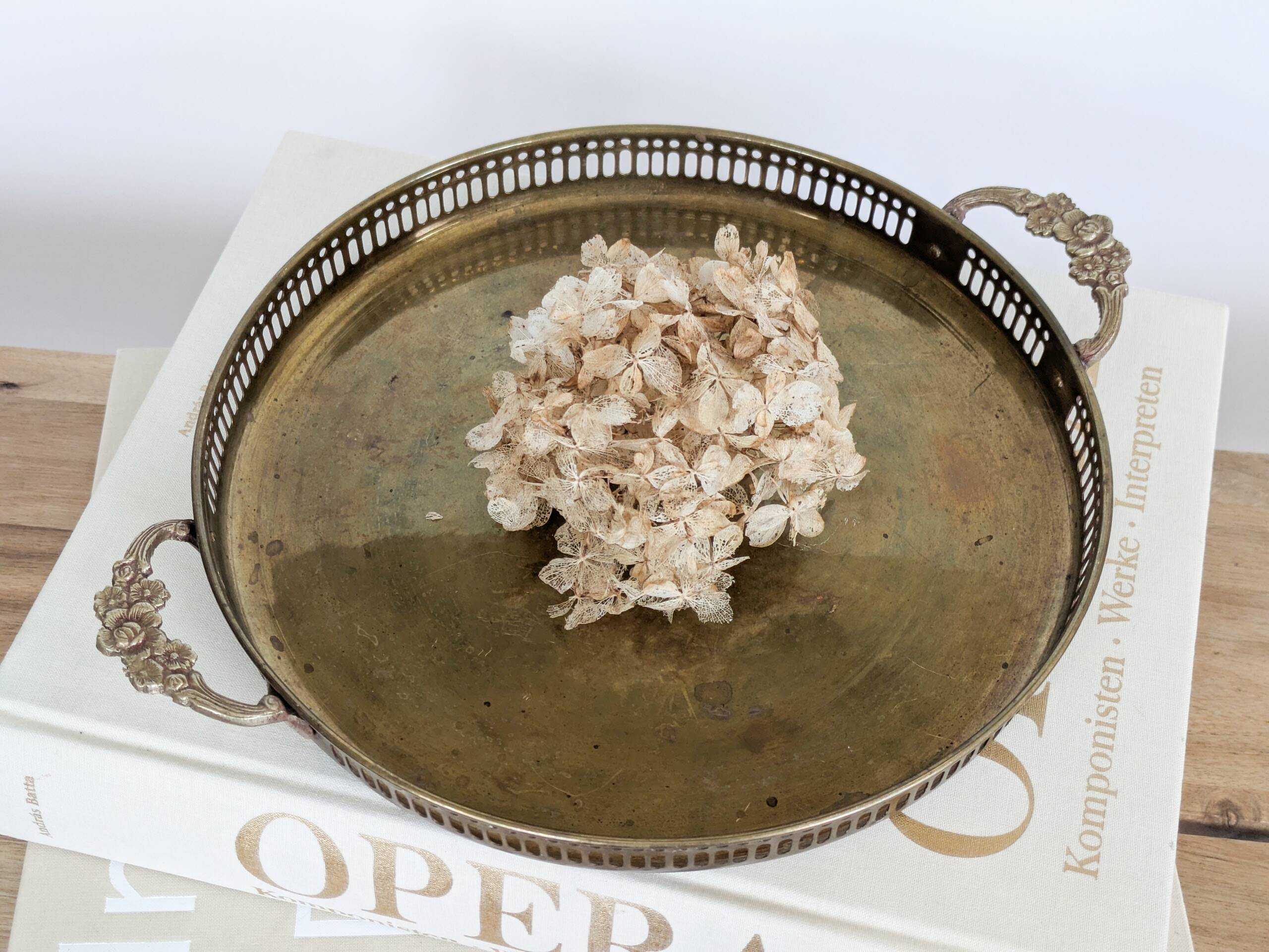 Vintage decorative brass tray, pierced edge and floral handles.