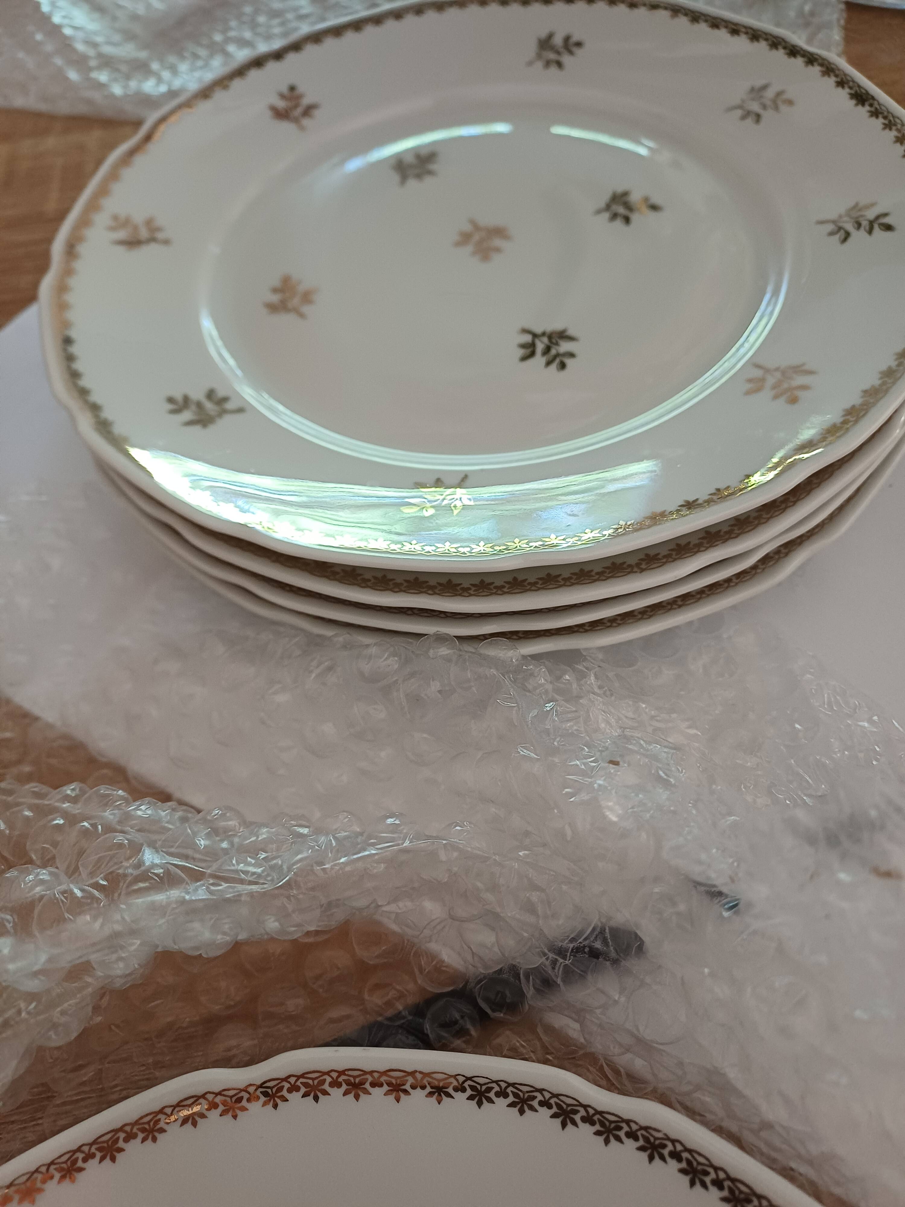 A lot of old white and gold porcelain plates T de F.