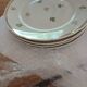A lot of old white and gold porcelain plates T de F.