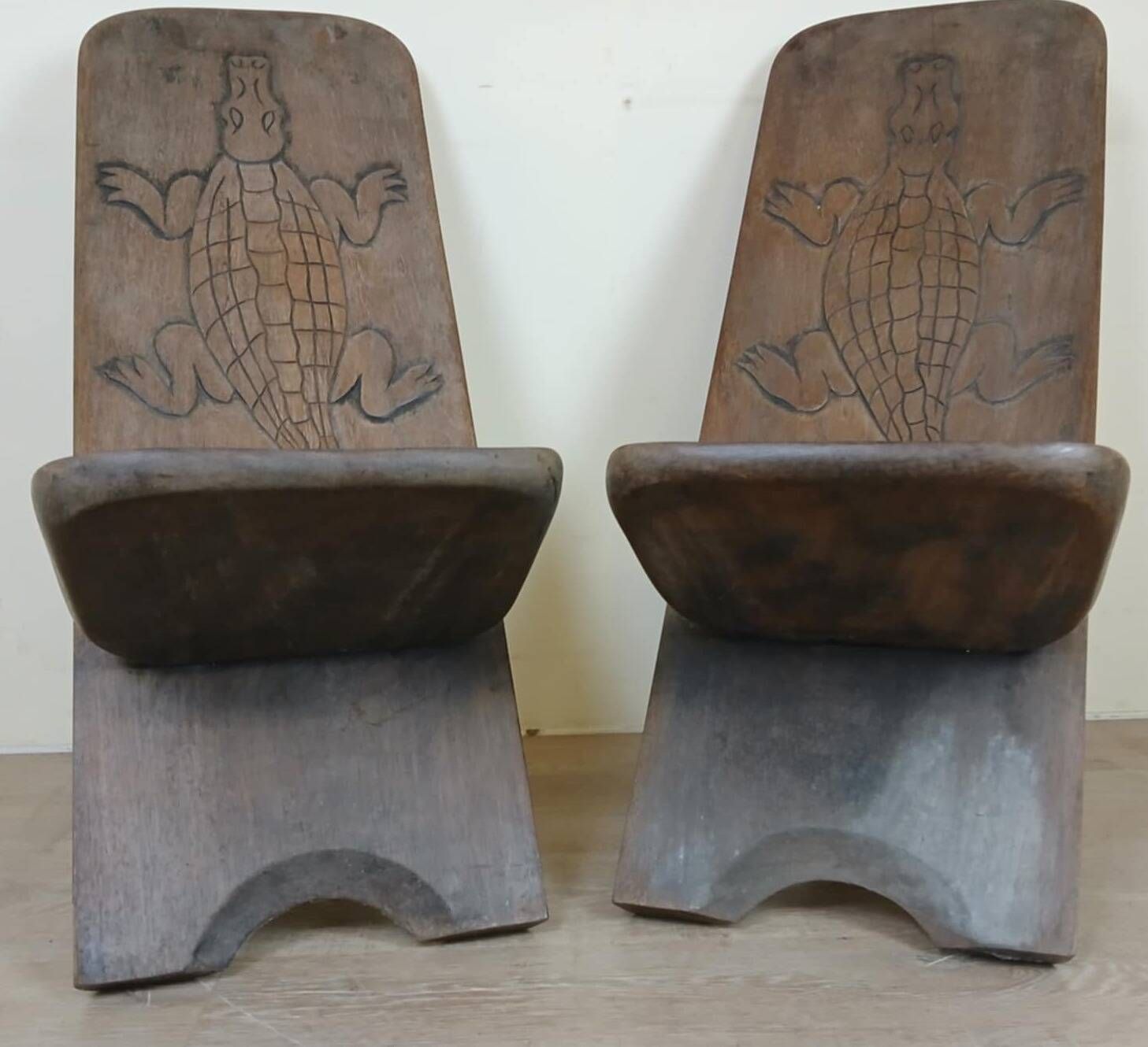 Central Africa circa 1950: pair of exotic wood chairs decorated with crocodile sculptures