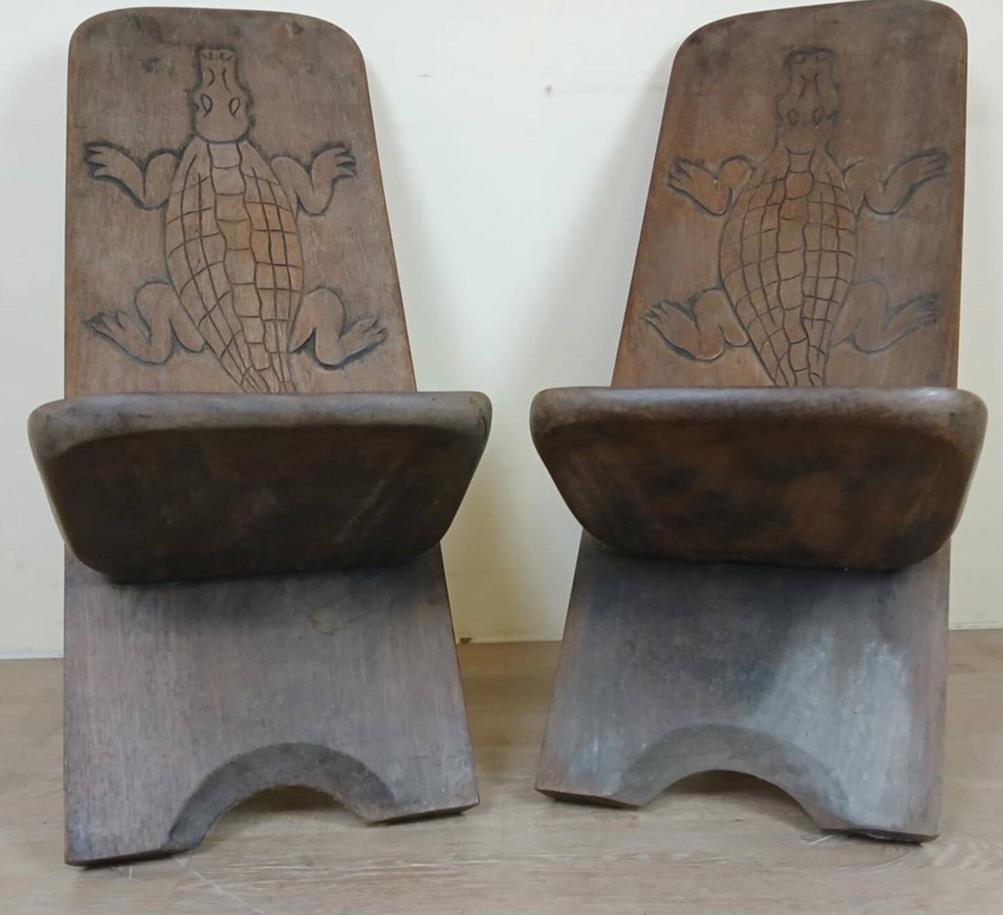 Central Africa circa 1950: pair of exotic wood chairs decorated with crocodile sculptures