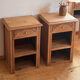Pair of antique bedside tables / nightstands in raw solid oak.