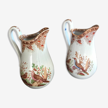 Pair of ancient pitchers decorated with exotic birds.