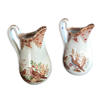 Pair of ancient pitchers decorated with exotic birds.