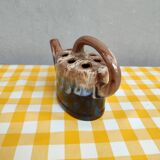 Alpho earthenware spikes in the shape of a watering can