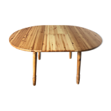 Round table in varnished pine with extension cord