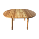 Round table in varnished pine with extension cord