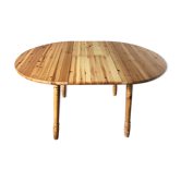 Round table in varnished pine with extension cord