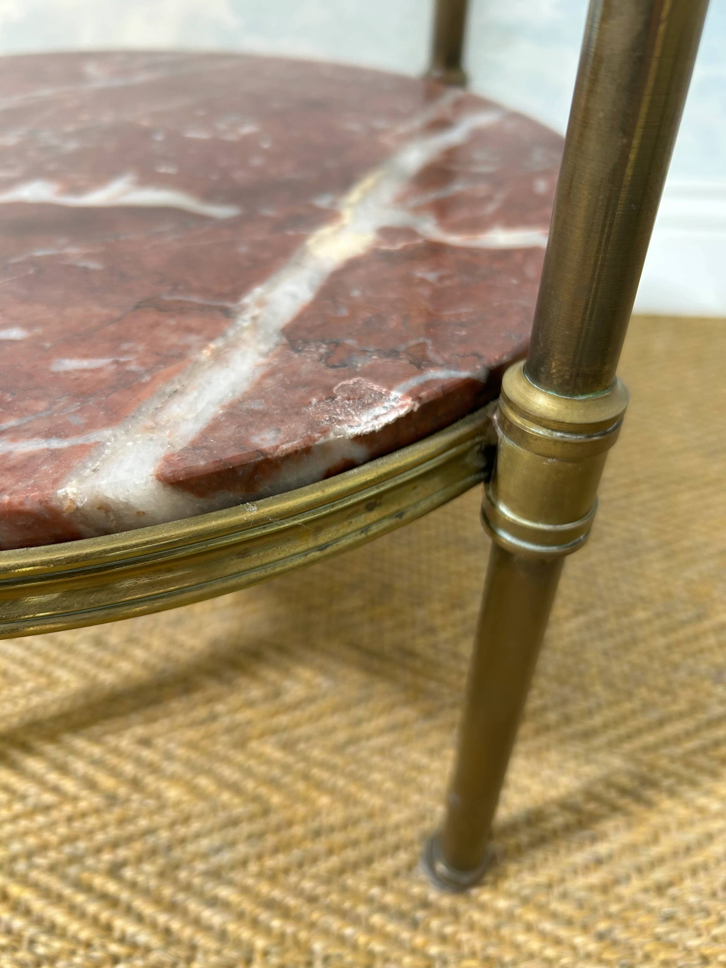 Two-tiered gueridon in Emperador marble on a brass structure, 1970s.