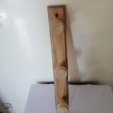 Old wall coat rack in raw wood