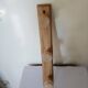 Old wall coat rack in raw wood