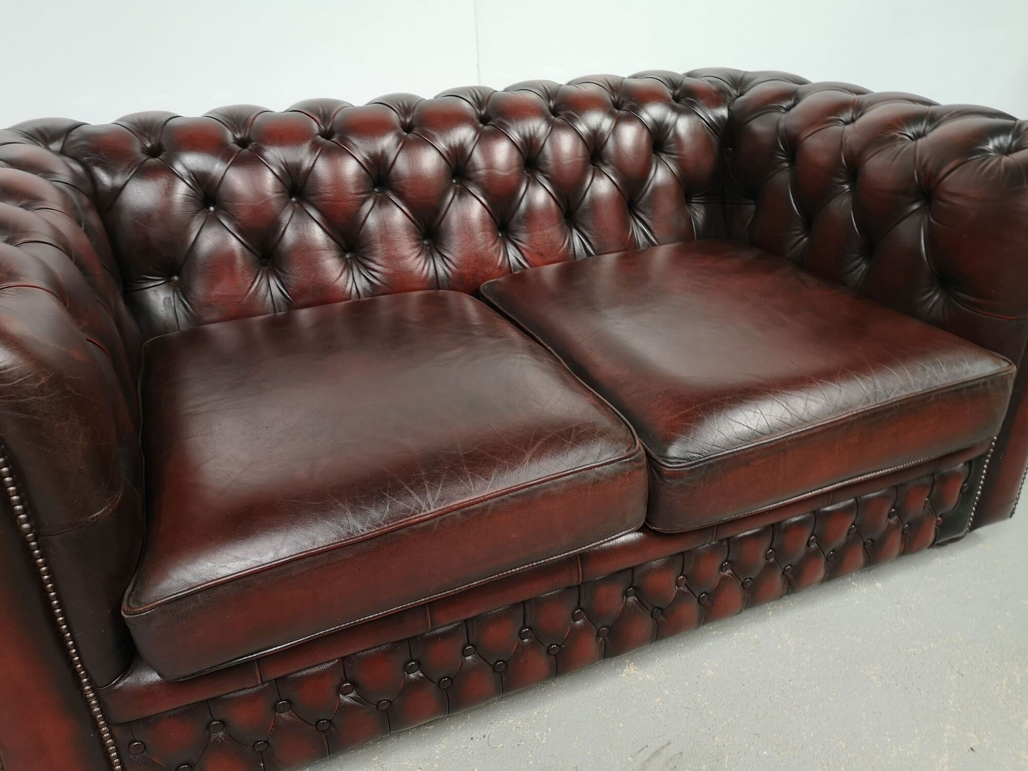 Convertible leather chesterfield sofa