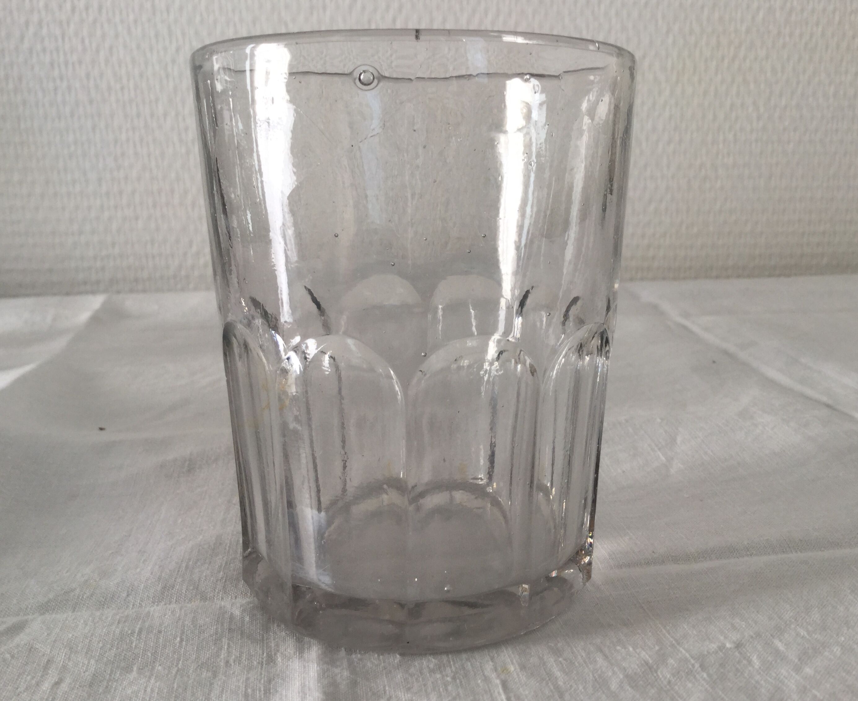 Old ribbed glasses without a foot