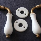 Set of two porcelain door handles with two rosettes