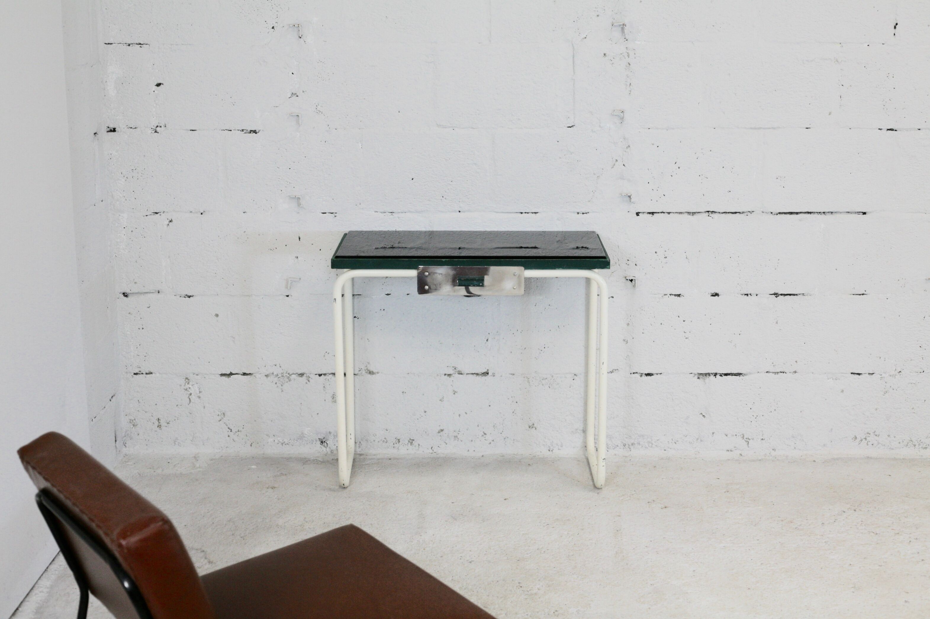 Tubular steel console, black glass tray, circa 1950