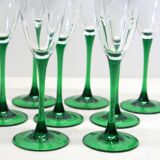 8 large green stem champagne flutes in very good condition.