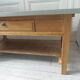 Table basse vintage, piétement, ceinture, tiroir et tablette bois, plateau vert de gris.