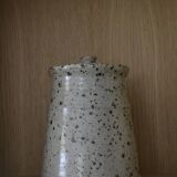 Pot with speckled sandstone lid