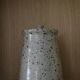 Pot with speckled sandstone lid