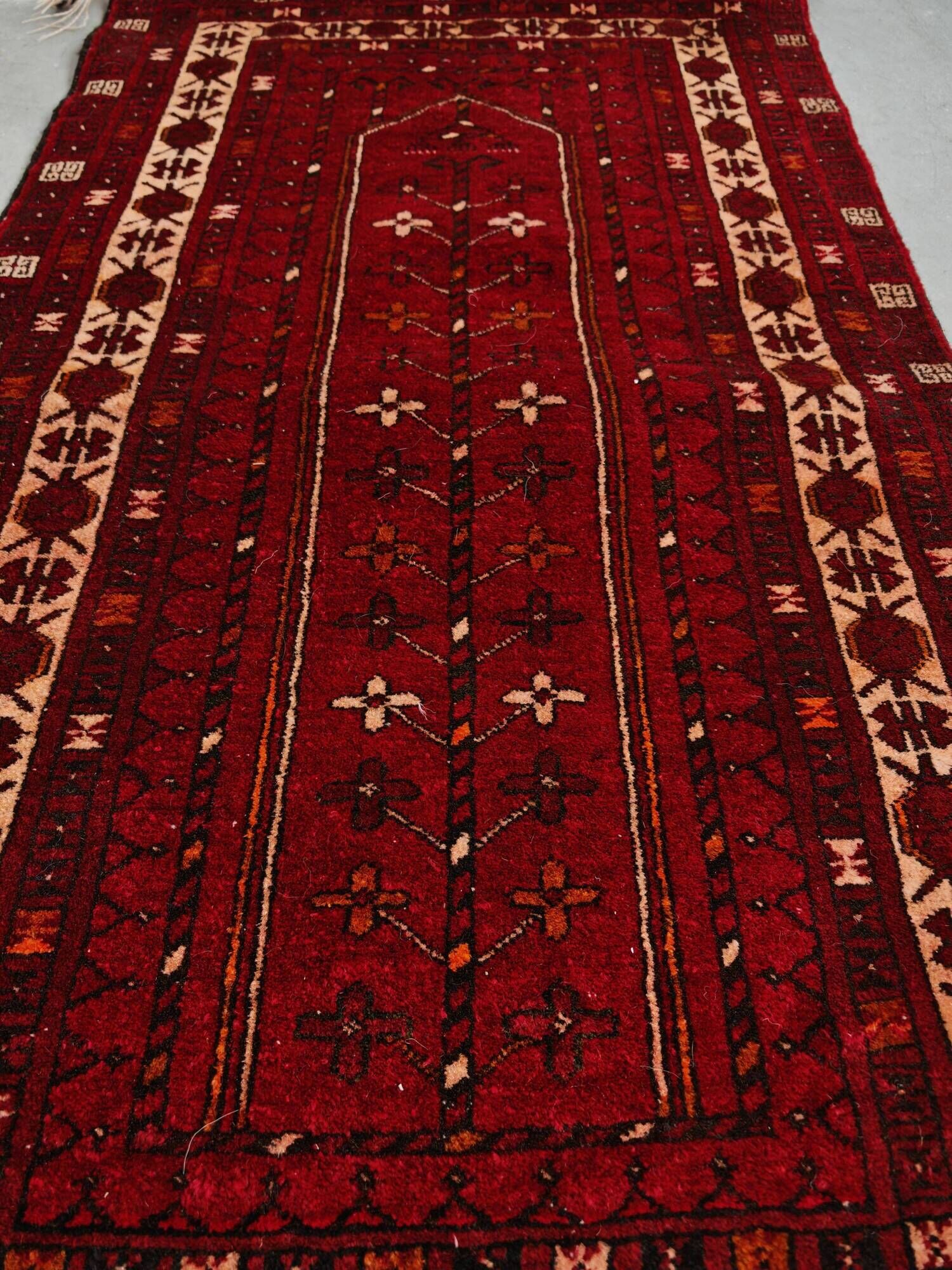 Vintage Afghan tribal prayer rug, hand-knotted from the 1950s.