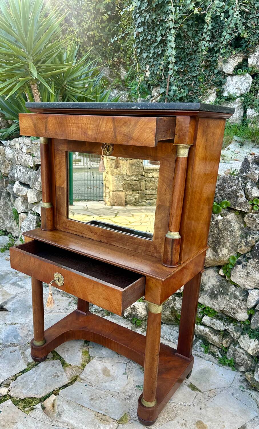 A small piece of Bonheur du jour with detached columns in Empire-era mahogany.