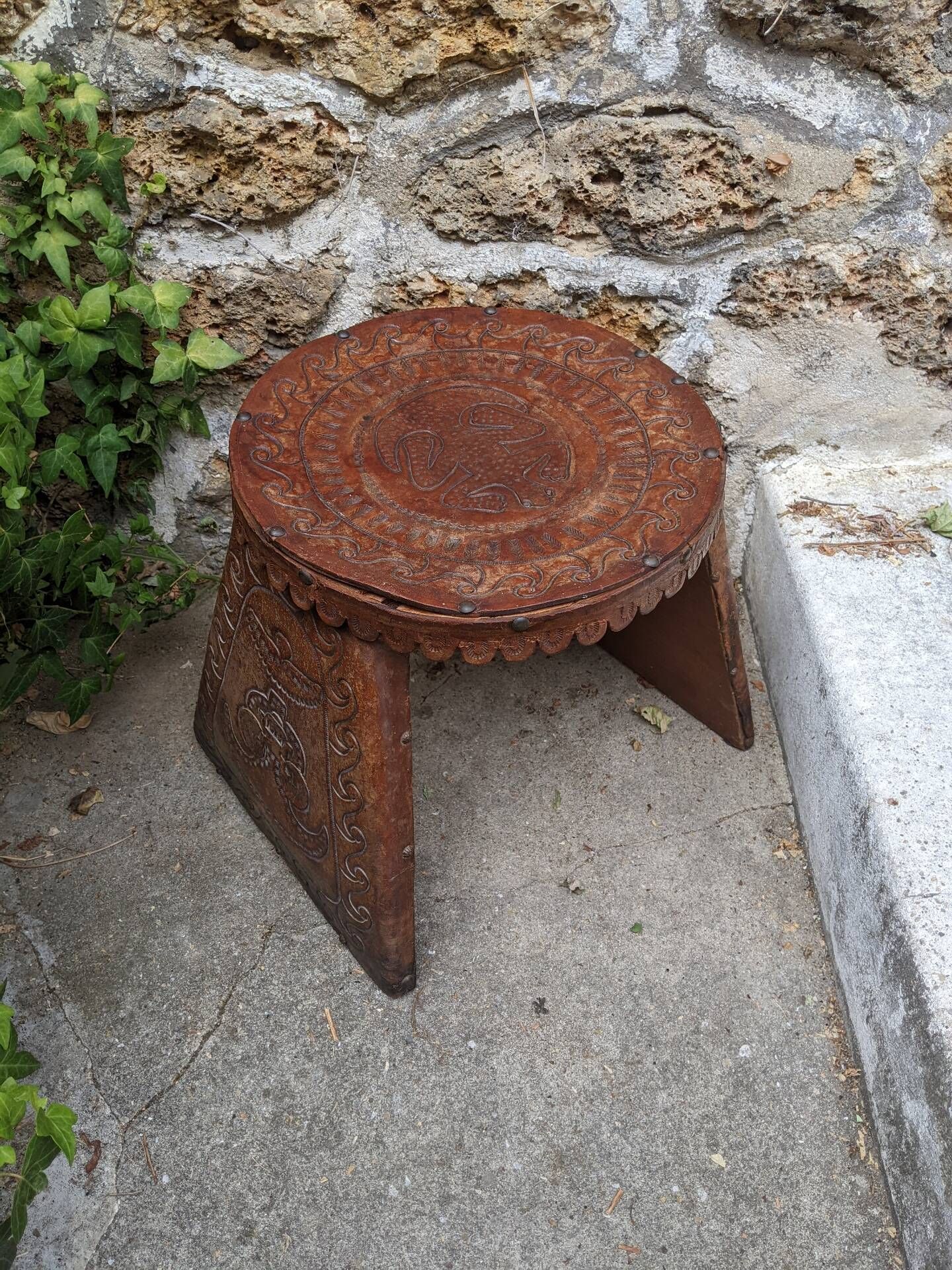 Wood and leather stool, handcrafted African art.