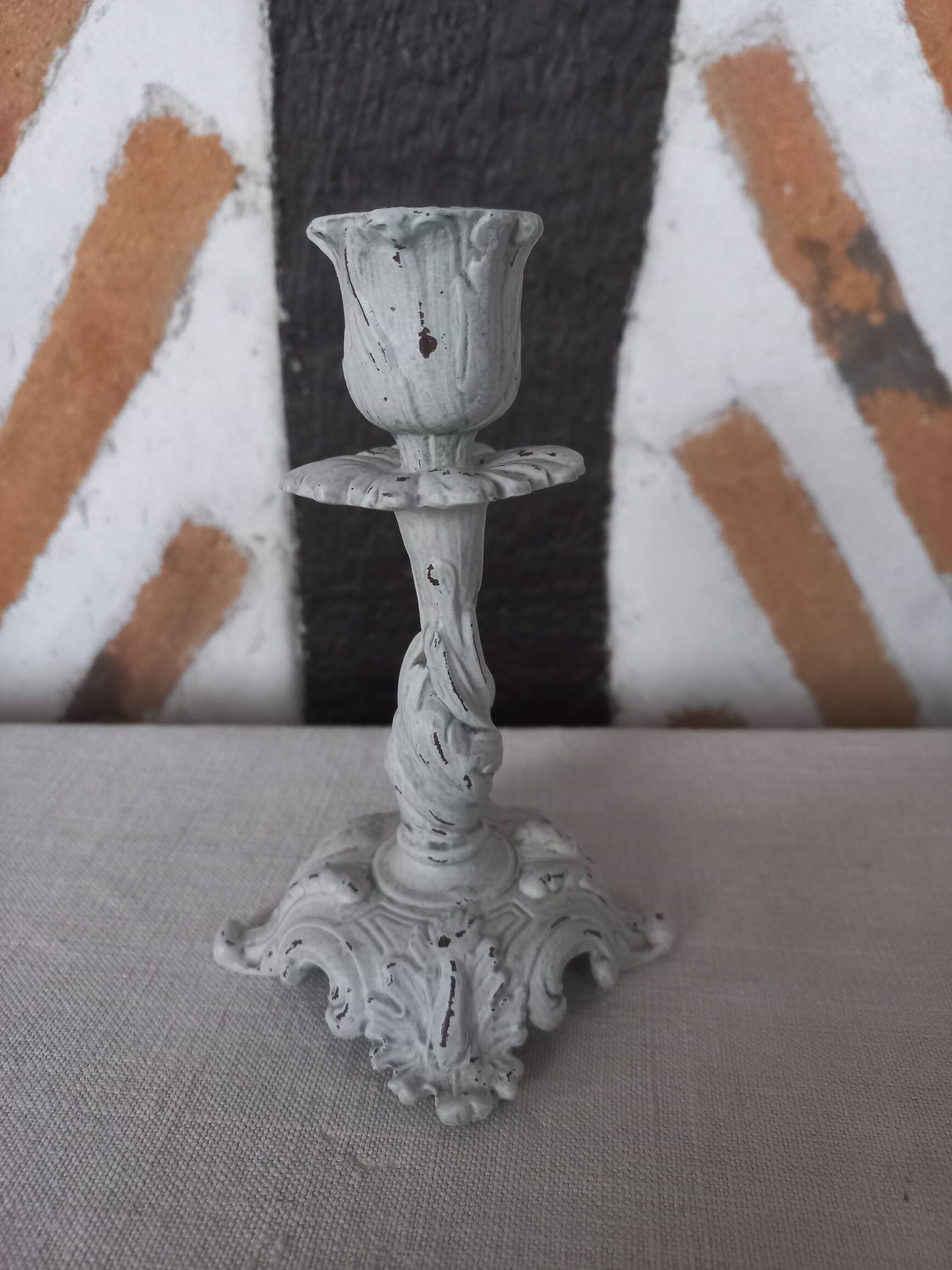 Old grayed white patinated candle holder