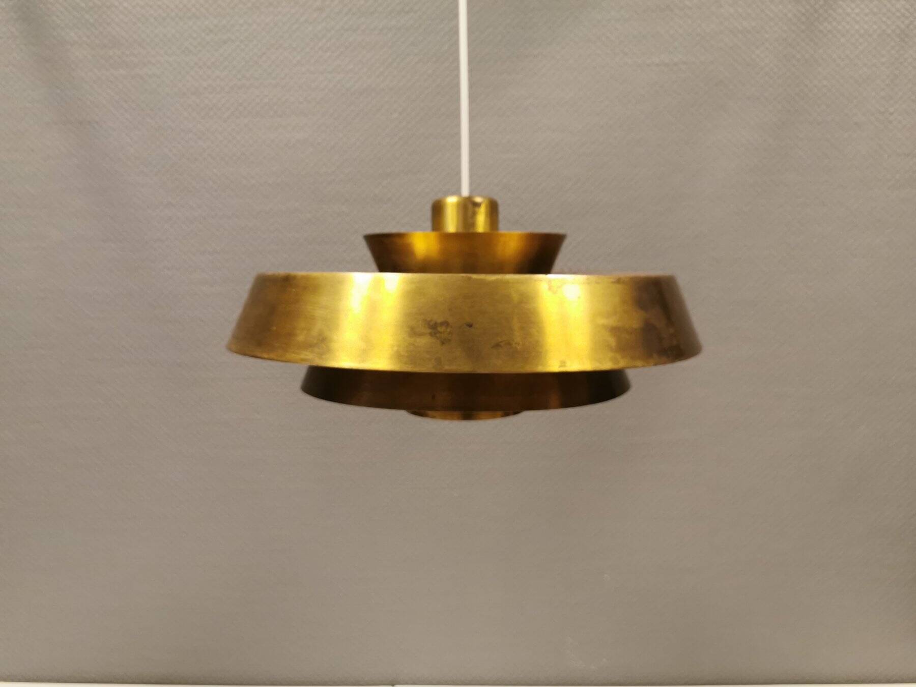 A mid-century Danish hanging lamp in solid brass by Jo Hammerborg for Fog & Mørup.