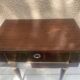 Nightstand with lovely mid-century style gold metal decor.