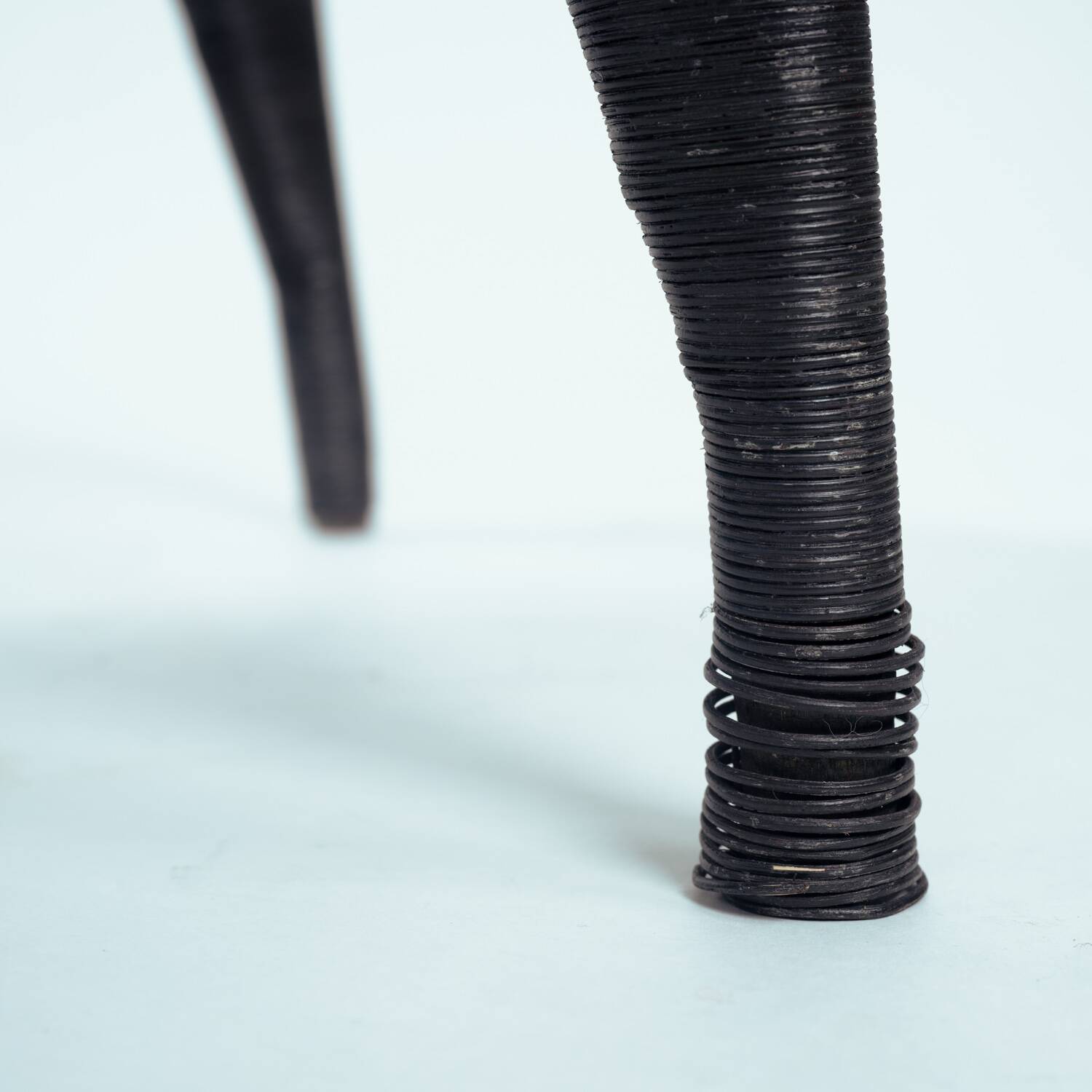 Sculptural rattan tripod armchairs in the manner of Boris Sipek