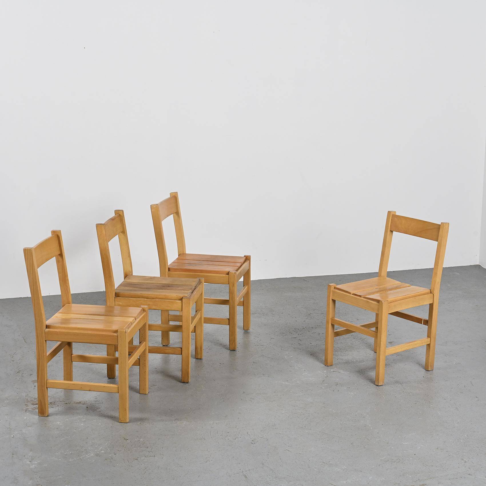 Suite of four chairs in the style of Maison Regain