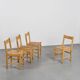 Suite of four chairs in the style of Maison Regain