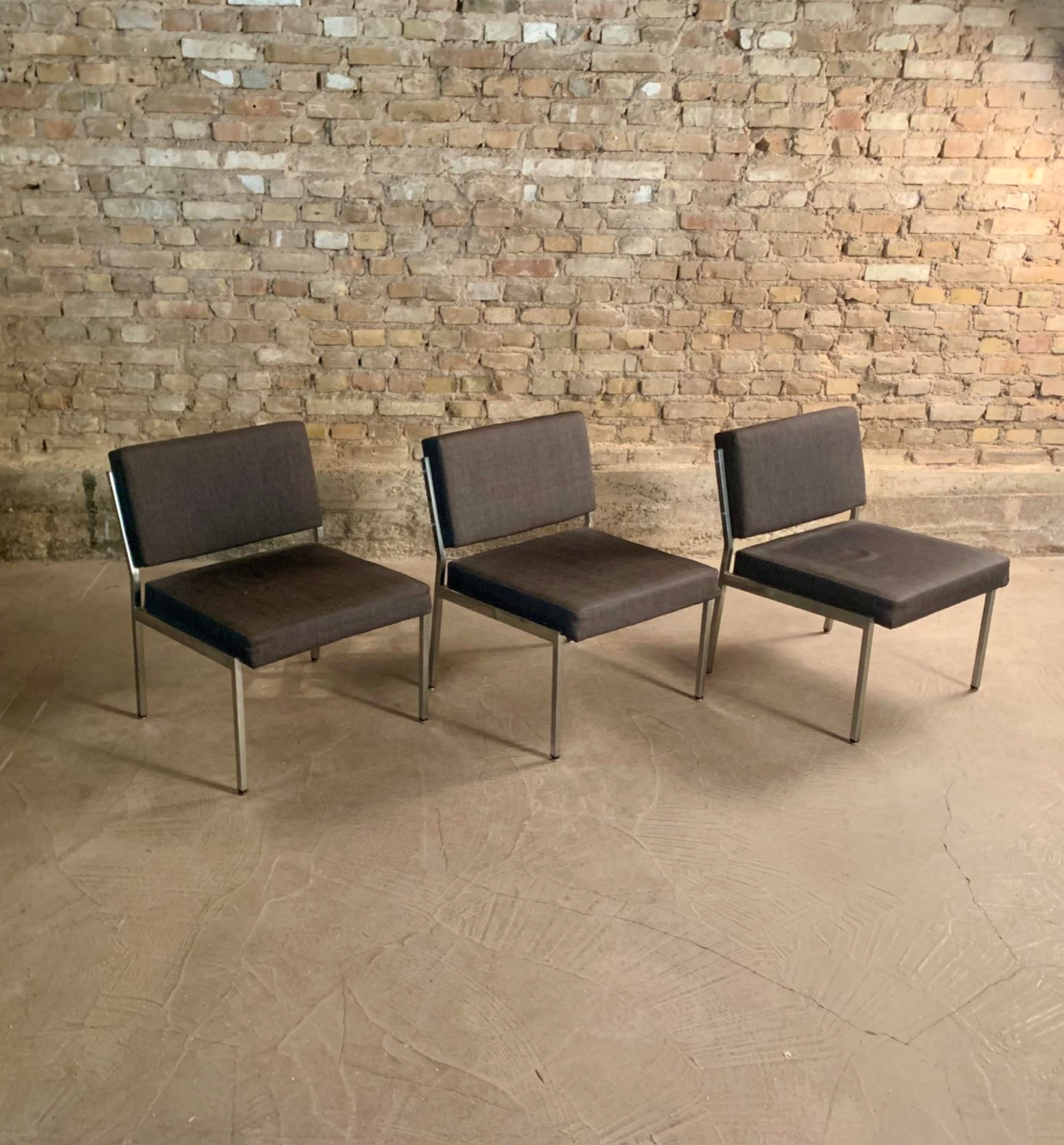 Armchair in metal and grey fabric