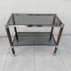 Vintage dessert table in wood, smoked glass, chrome metal, and wood.