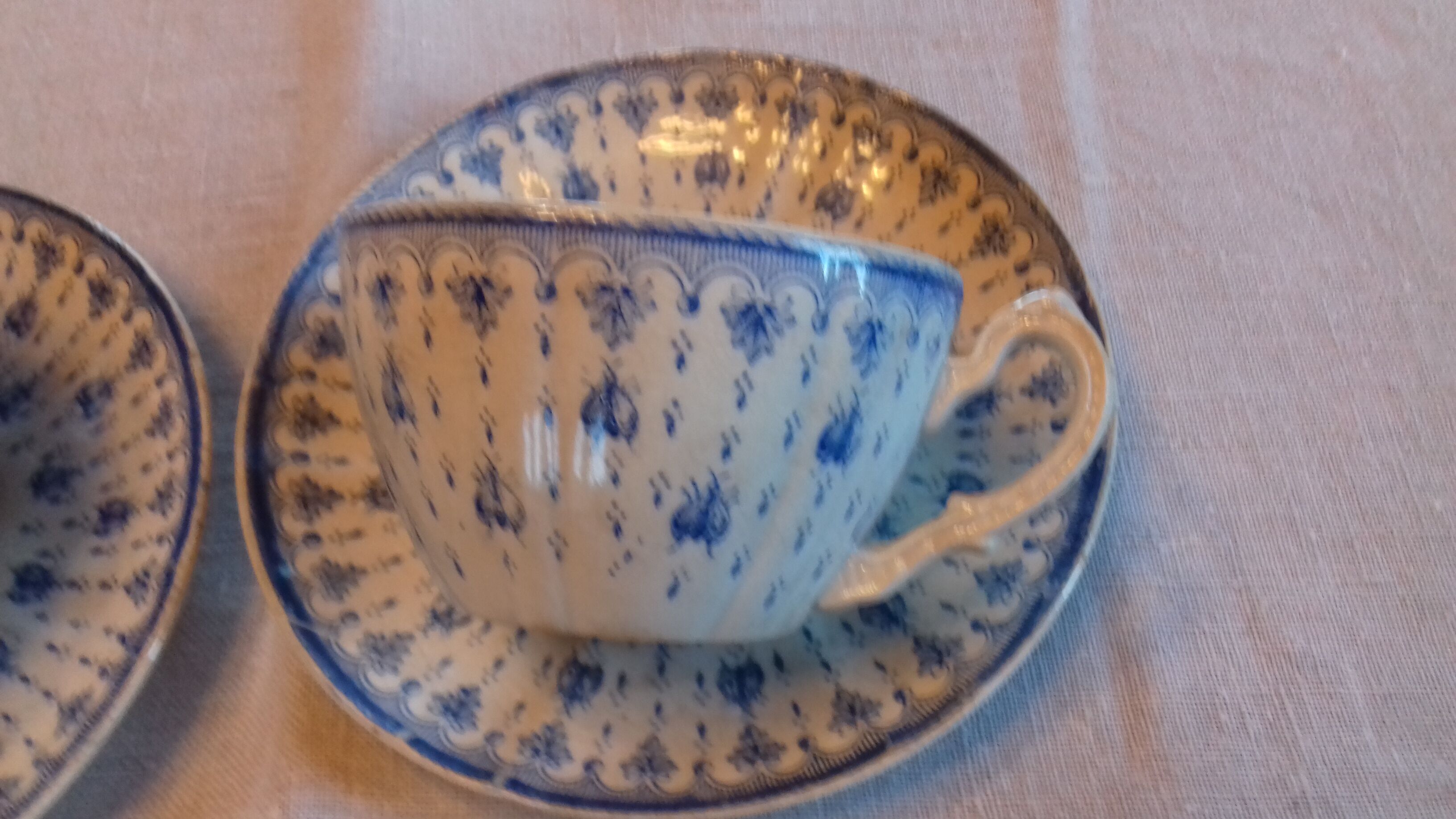 2 old coffee cups with their saucer, with blue bee patterns